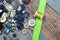 Vintage buttons, spool with thread and green tape on aged boards