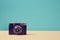 Vintage camera on blue background. Retro device for recording visual images. Travelling. Blogging. Memories concept