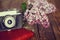 Vintage camera and Bouquet of lilac spring flowers