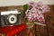 Vintage camera and Bouquet of lilac spring flowers
