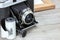 Vintage camera, roll films and photo frame on gray wooden boards