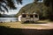 A vintage camper parked by a serene lake