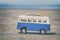 Vintage Camper Toy with Surfing Boards on Beach