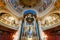 Vintage candlesticks under the dome of the catholic church with paintings and antique decoration