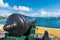 Vintage cannon facing the Caribbean ocean defending the bay. Vi