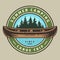 Vintage canoe trip round colorful logo