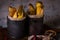 Vintage cans with fried potato stripps on wooden board