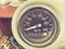 Vintage car dashboard with chrome rims speedometer tachometer