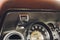 Vintage car dashboard with chrome rims speedometer tachometer. speedometer tachometer