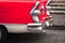 Vintage car fragment. Chromed rear lights and bumper