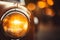 Vintage car headlights with captivating blurred bokeh effect against a sunset backdrop