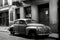 A vintage car parked on a city street