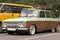 Vintage car with suitcases on the roof. Abandoned auto