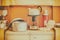 Vintage caravan kitchen interior with stove and kettle