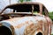 Vintage cars abandoned and rusting away