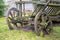 Vintage cart. Damaged.antique transport.Retro cart standing on the lawn. Dray in grass. Old.