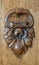 Vintage carved oak ornament, brown pattern background