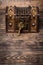 Vintage casket and key on wooden background