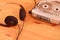 Vintage cassette tape audio player and Retro headphone on wooden background, gadgets for The 70-80-90`s