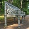 Vintage cast-iron garden bench on the path of Pavlovsky Park. Pavlovsk