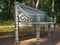 Vintage cast-iron garden bench on the path of Pavlovsky Park. Pavlovsk