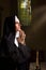 Vintage catholic nun in prayer