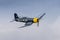 A vintage Chance Vought FG-1D Corsair world war 2 us navy fighter in flight