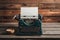 Vintage charm typewriter rests on rustic wooden backdrop
