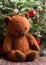 Vintage cheerful stuffed teddy bear toy under the christmas tree