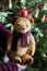 Vintage cheerful stuffed teddy bear toy under the christmas tree