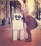 Vintage Child Hugging Robot Friend Outside