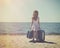 Vintage Child at Sunny Beach with Travel Suitcase