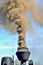 Vintage chimney of steam locomotive with smoke