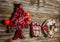 Vintage christmas decoration: red, white things on wooden background.