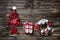 Vintage christmas decoration: red, white things on wooden background.