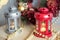 Vintage Christmas Lanterns Red and gray with burning Candles. Cozy christmas decorations with golden beads and balls. Christmas