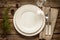 Vintage christmas table - empty white plate from above on wood