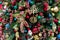 Vintage Christmas tree decorated with various toys and baubles. Festive new year background