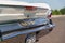 Vintage Chrysler New Yorker. View of the rear lights and chrome banner.