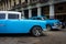 Vintage Chrysler next to old buildings in Havana