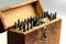 A vintage circular round corner punches set with an anvil with apertures in a wooden box.