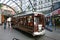 Vintage city tour tramcar, tramway, trolley waiting at indoor tram stop at Cathedral Junction, Christchurch, New Zealand