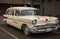 Vintage Classic car 1957 Chevy Ambulance Station wagon, Ambulance Service parked on a street. Old Ambulance car