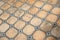 Vintage clay tile floor with decorative grid pattern