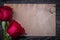 Vintage clean paper red natural roses on wooden