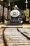 Vintage coal burning steam engine locomotive loading at the station.