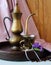 Vintage coffee pot, cup of coffee and a bouquet of violets