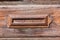 Vintage colonial mailbox on the aged wooden door, horizontal composition, Antigua, Guatemala