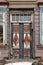 Vintage color entry door in aged wooden house in Germany