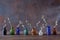 Vintage colored glass bottles with flowering willow branches, on